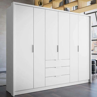 White 6-door wardrobe with three central drawers and slim integrated handles.