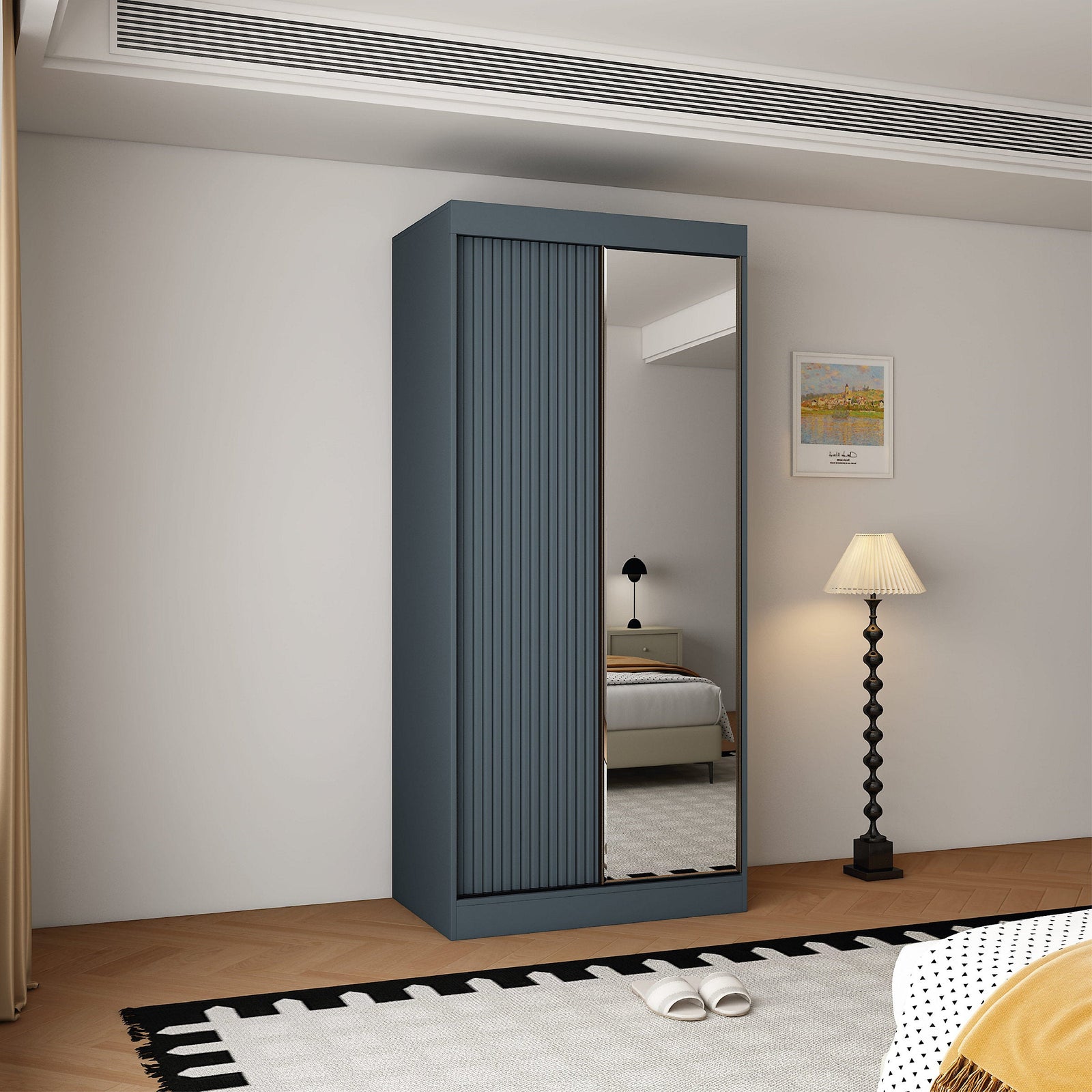 Berlin 100cm 2 door sliding wardrobe in dark grey with mirrored door reflecting a bed and lamp.