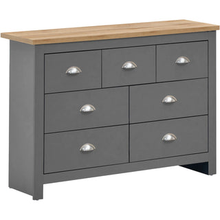 Lisbon light grey chest of drawers with oak effect top and seven drawers with silver cup handles.