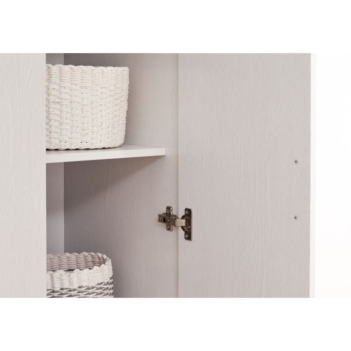White wardrobe interior with shelf, white woven basket, and grey woven basket. Visible hinge on the door.
