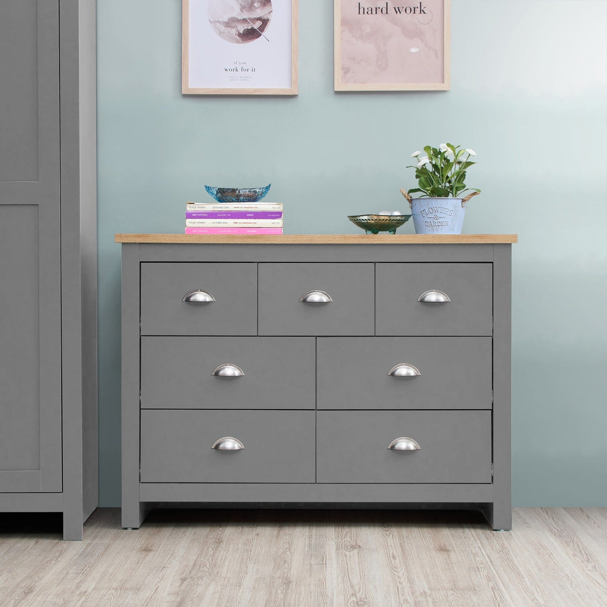 Light grey 7 drawer chest of drawers with oak effect top and silver handles