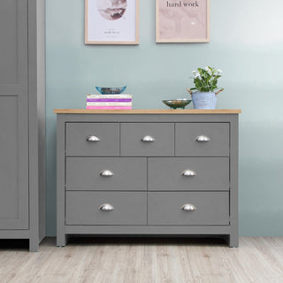 Light grey 7 drawer chest of drawers with oak effect top and silver handles