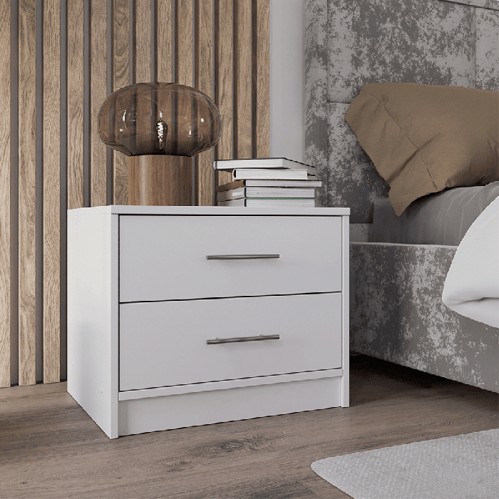 KIRKLEES white 2 drawer bedside table with brown lamp and books next to bed