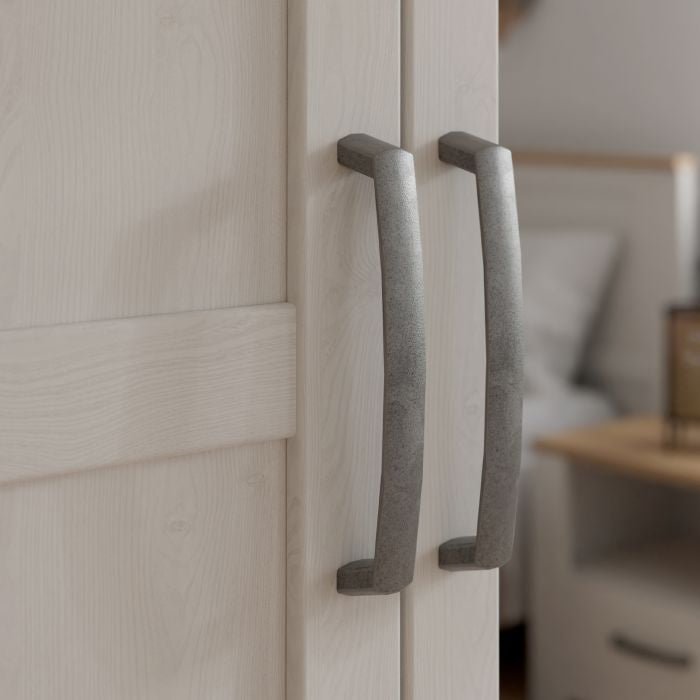 Wardrobe doors in Riviera Oak finish with textured metal handles