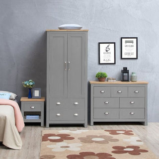 Grey 2-door wardrobe with matching chest of drawers and bedside table.