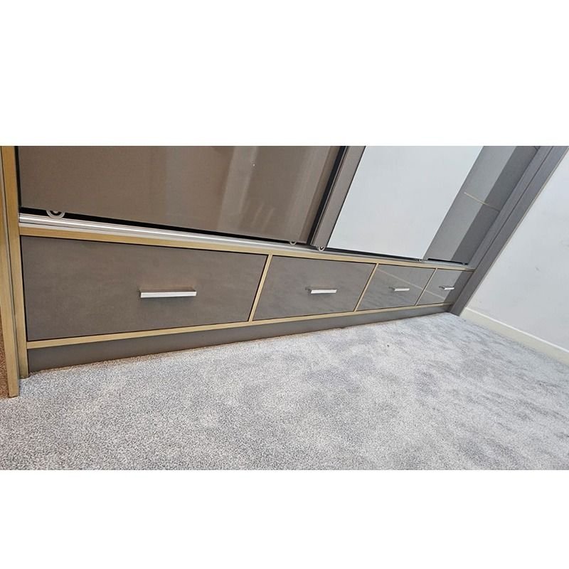 Grey gloss sliding wardrobe with mirrored centre door and four base drawers with silver handles