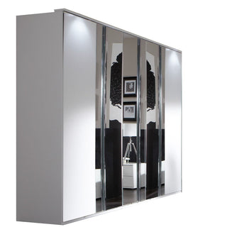 CHOICEWARDROBE Addis 225cm white 5-door sliding wardrobe with mirrored panels reflecting wall art and a lamp.