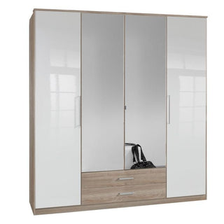 The GEMA 4 Door Mirrored Wardrobe Oak and White Gloss 180cm features two central mirrored doors, two outer white gloss doors, and two base wooden drawers. Reflected in the mirrors is a black handbag, adding an elegant touch.